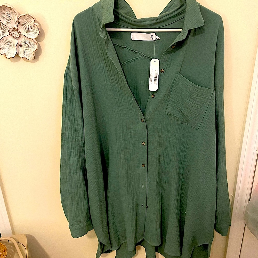 Good Company One Size button over green shirt